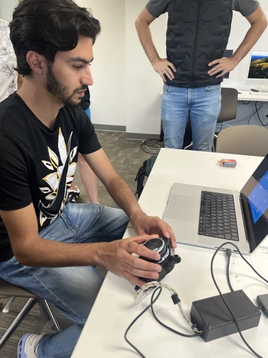 Working with electronics beside a laptop