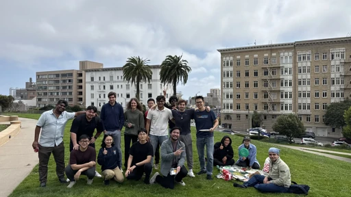 Friends relaxing on a campus lawn